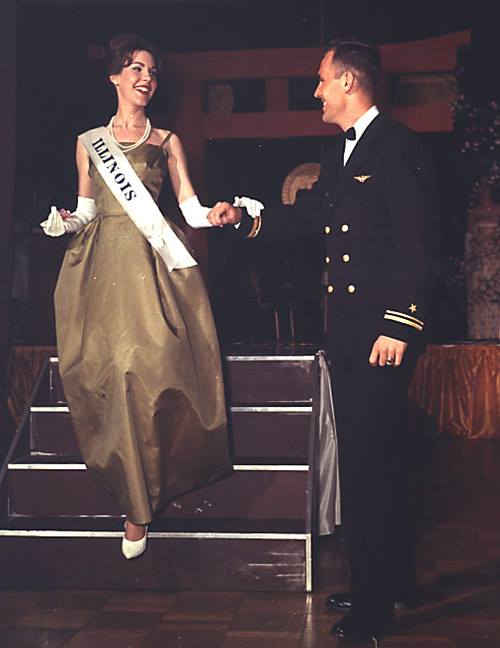 Kate Springer of Springfield, Illinois was the daughter of Congressman and Mrs. William Springer, She was sponsored by the Illinois State Society to represent our state in the 1963 National Cherry Blossom Festival. She is shown at the ball escorted by Navy Lt. John F. Kennedy who by coincidence had the same name as President Kennedy but was no relation to that family from Massachusetts.